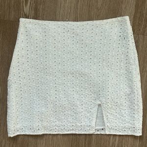 White eyelet mini skirt with slit